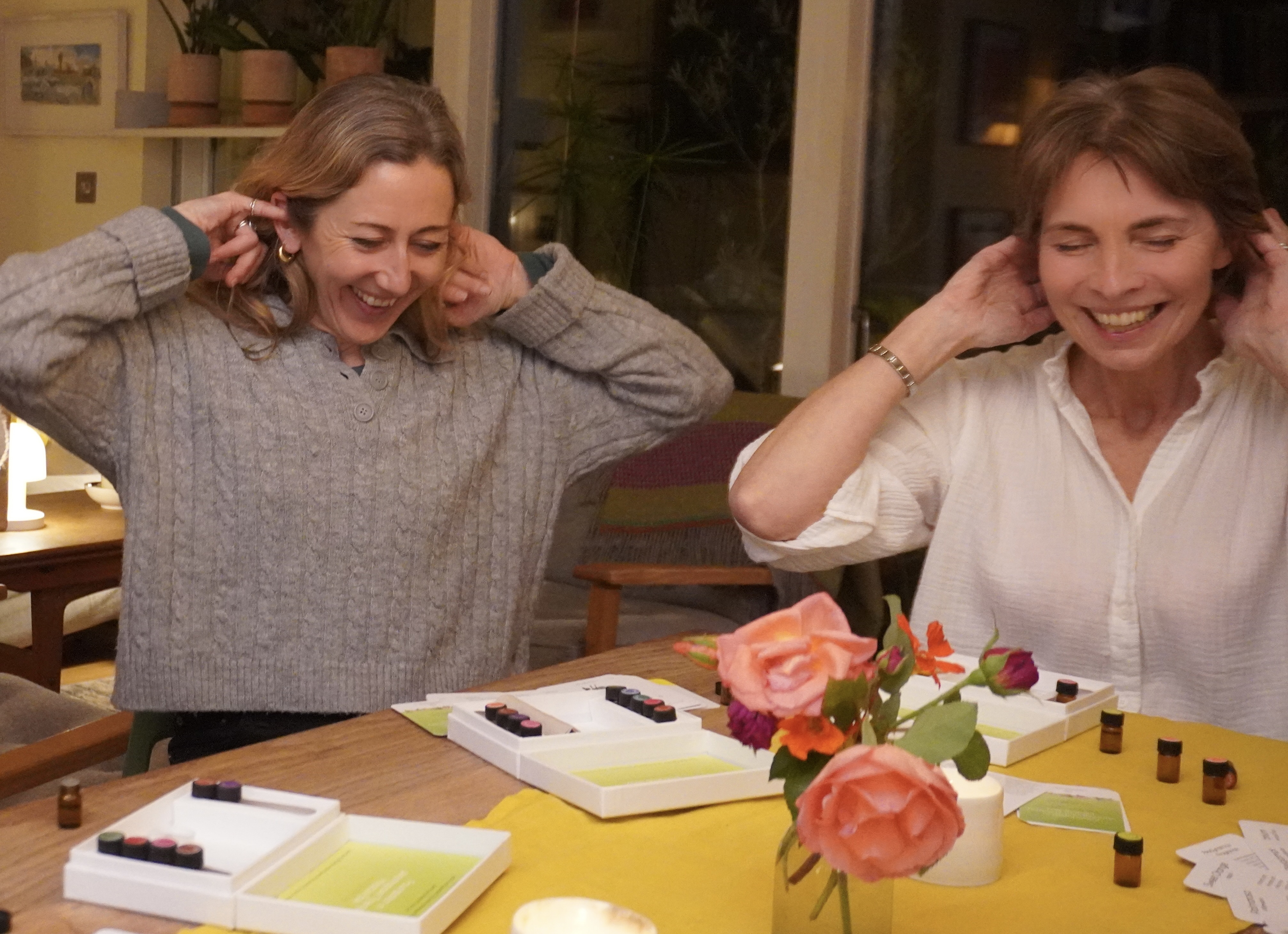 Two participants laughing together in the practice
